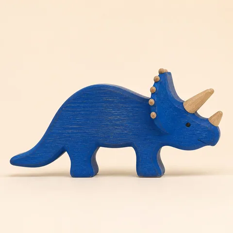Original photo of a blue wooden triceratops toy